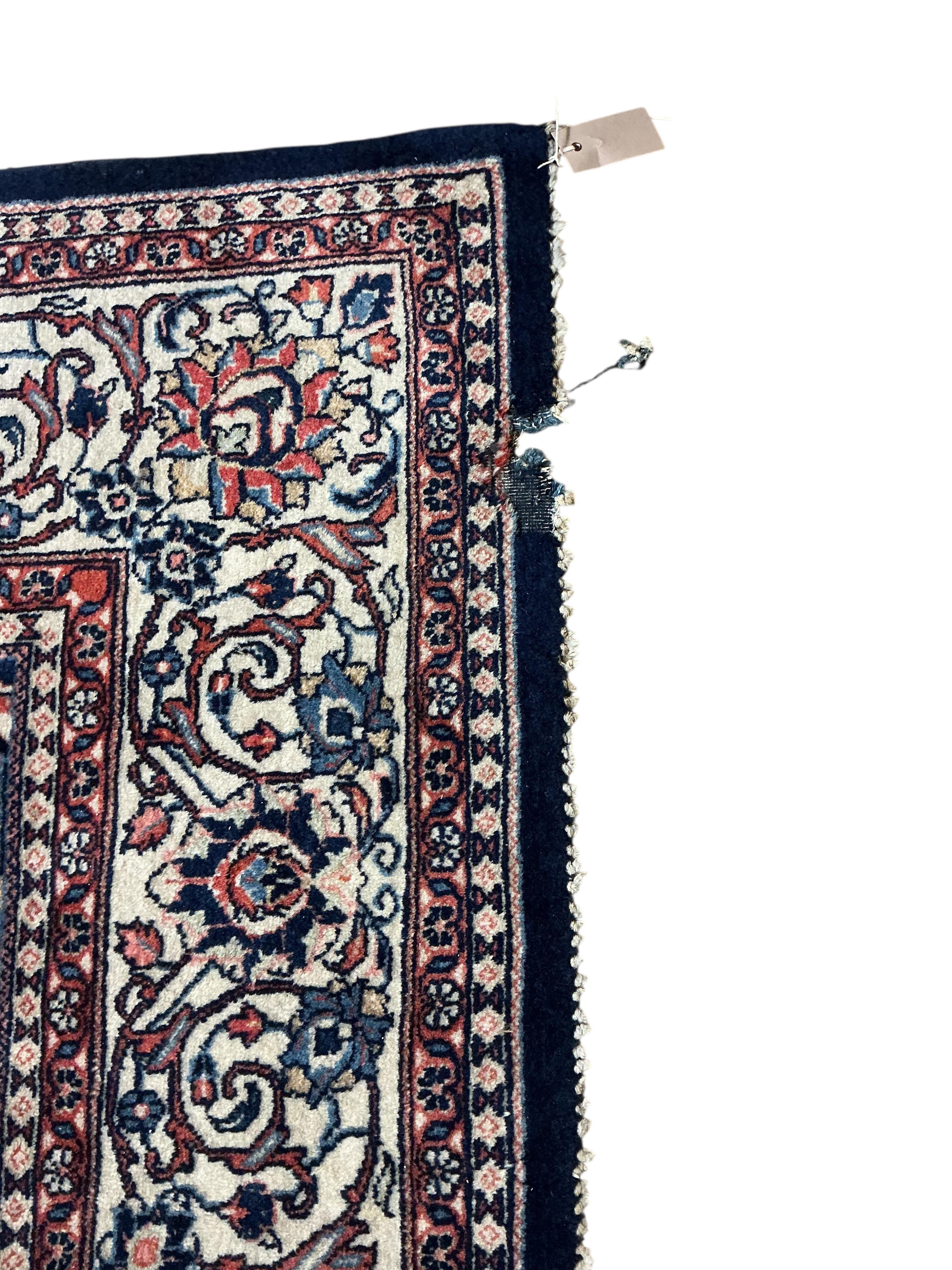 A Sarouk blue ground carpet, 320 x 210cm